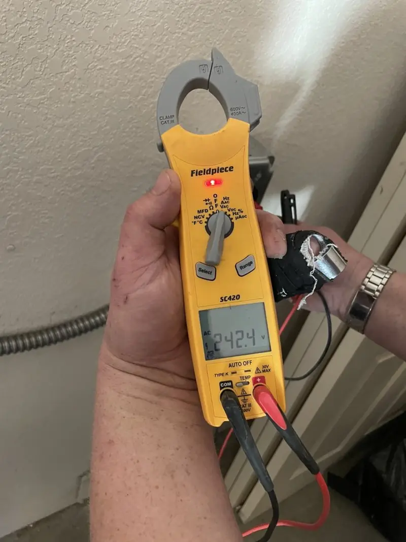 Voltage testing with clamp meter during Outlet Installation in Columbia
